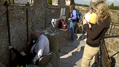 Planting a smooch on the Blarney Stone